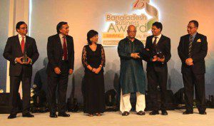 SM Mahbubul Alam, director of Walton Hi-tech Industries, receives the award from Finance Minister AMA Muhith